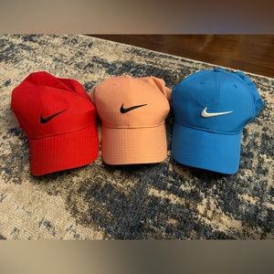Set of 3. Nike golf hats. Red, blue, & pink.